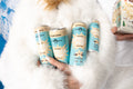 Cream Soda cans with Après Pack box in snowy setting