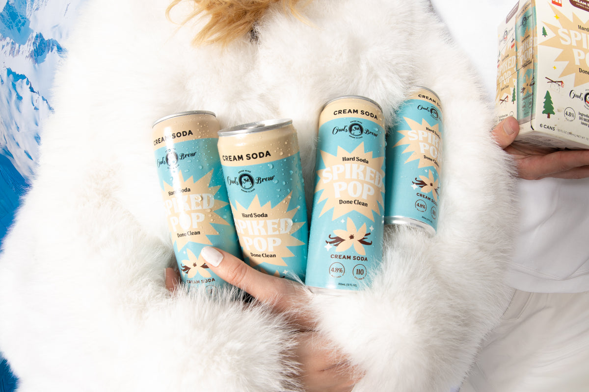 Cream Soda cans with Après Pack box in snowy setting